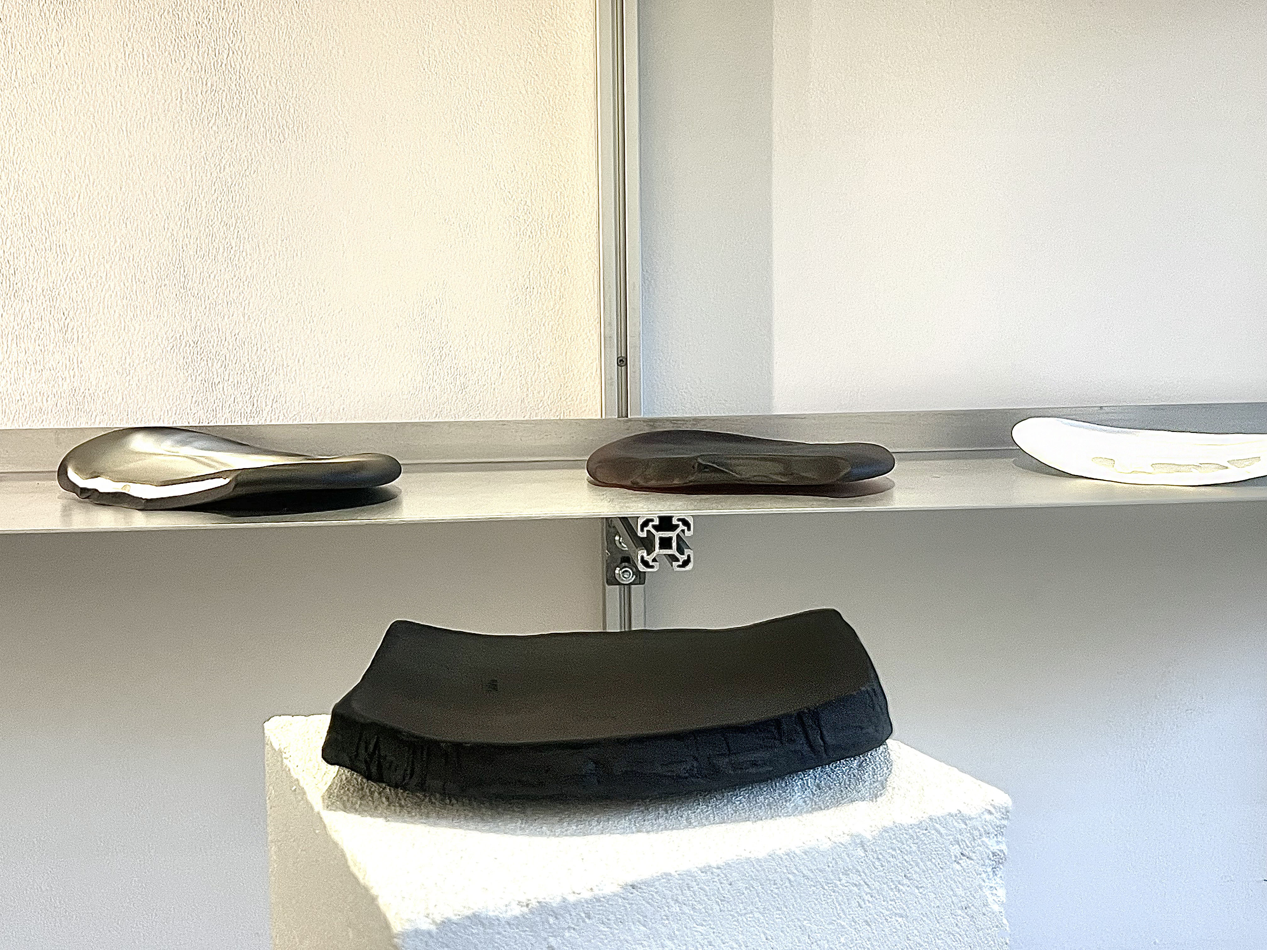 The work of both countries together — clay and glass in real space