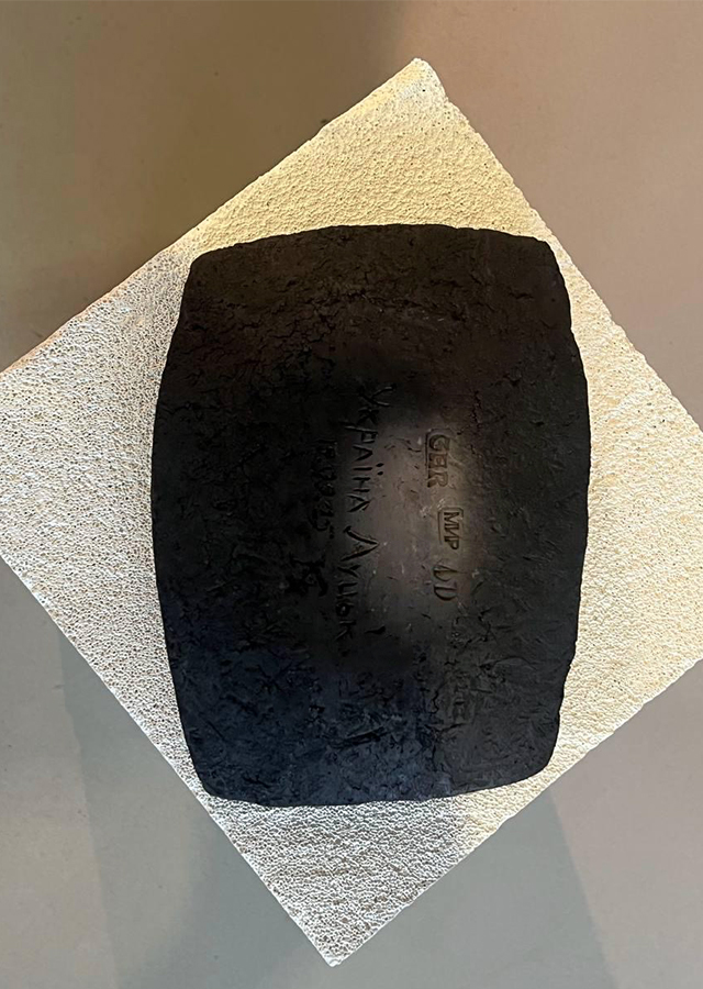 Black clay plate with GAR stamp