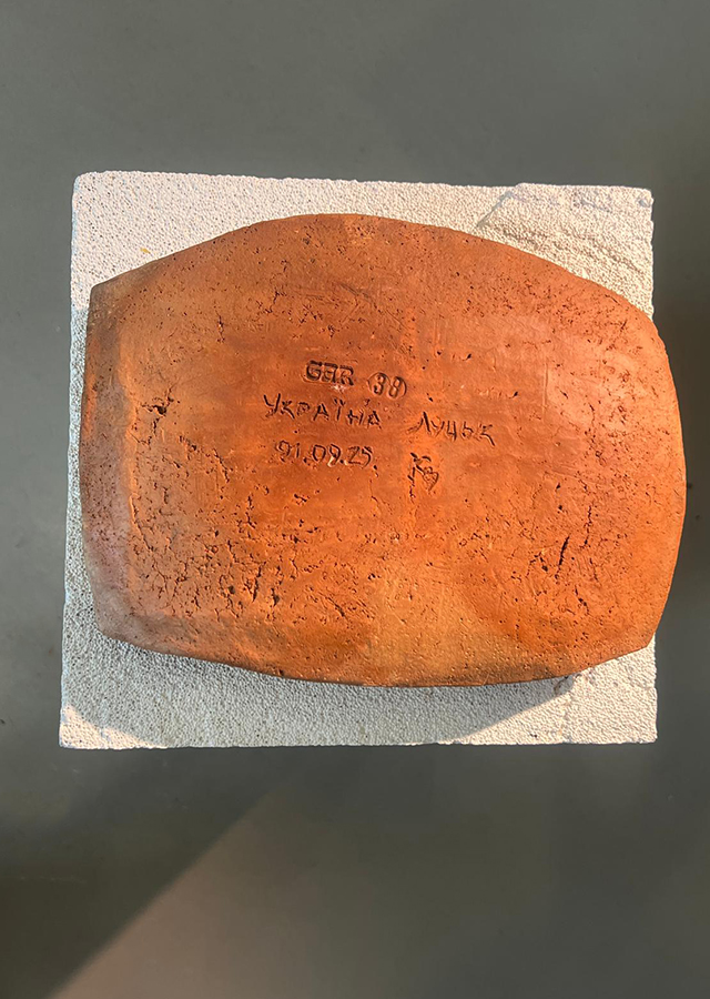 Red clay plate with inscription