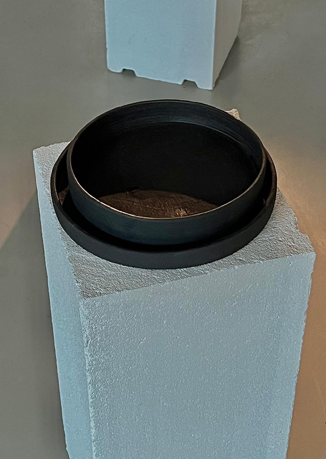 Black clay bowls on pedestal